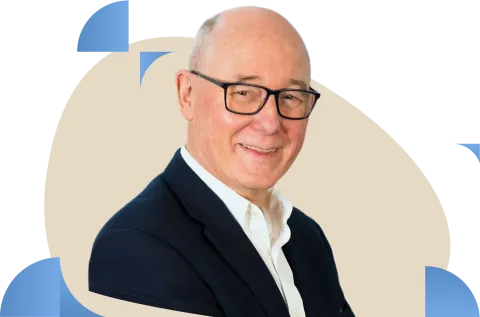 Professional headshot with glasses against beige circular background with blue accents