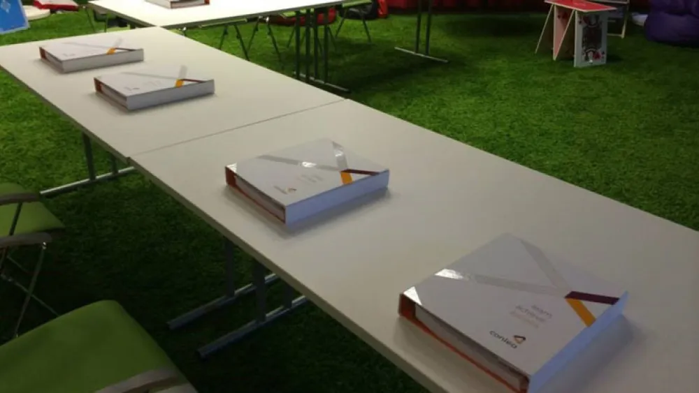 Study guides neatly laid out on desks in anticipation of an impending class