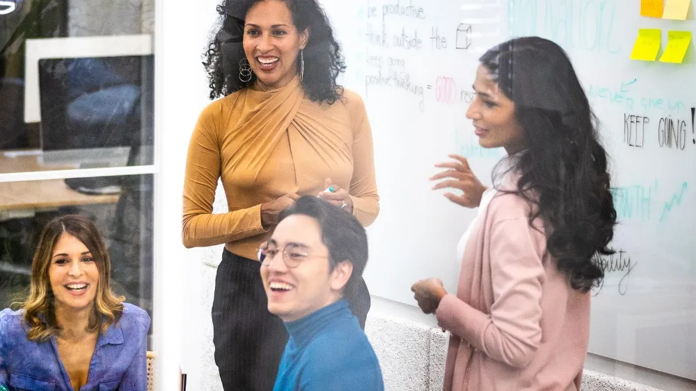 Agile Project Manager talks to her team